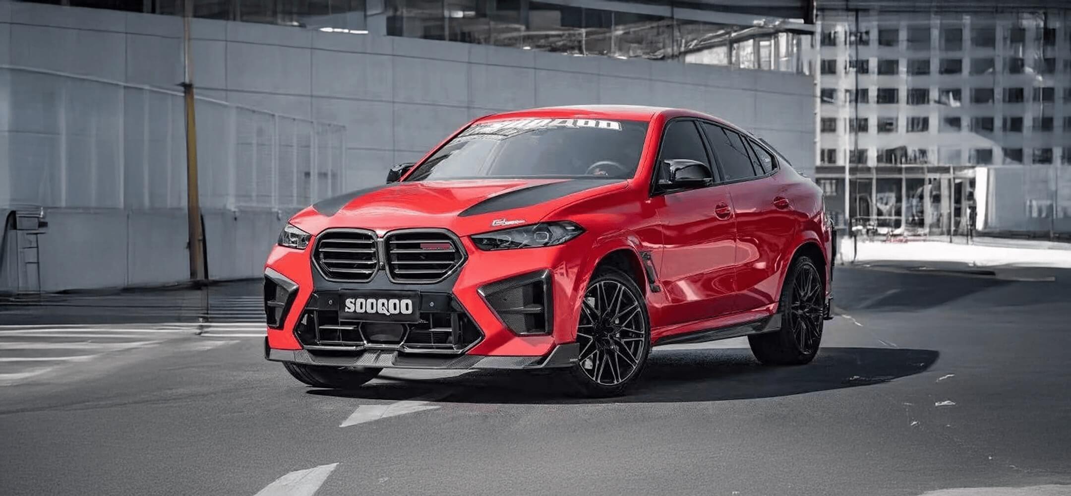 Red BMW X6M F96 SOOQOO car on a city street with modern buildings in the background
